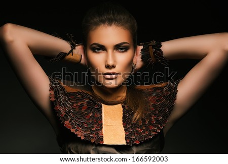 woman with hands behind neck