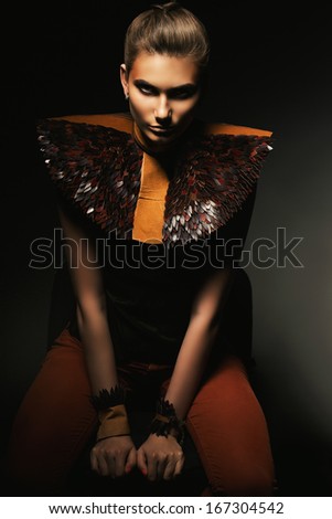 sitting mysterious woman in leather