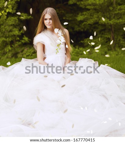 blond woman in large white dress