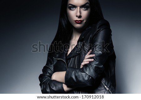 hot woman with red lips in leather jacket