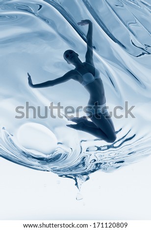 sporty woman inside water sphere