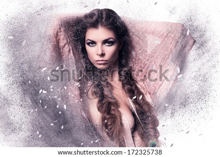 woman in pink scarf with feather in dust on white background