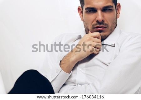 portrait of brown eyed man in white shirt
