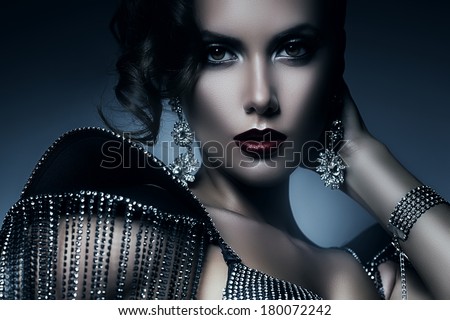 cold elegant woman in accessories of stones
