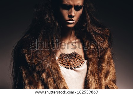 aggressive sexy woman in fur coat