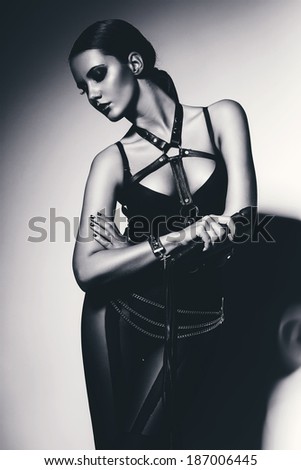 black and white sensual woman with whip