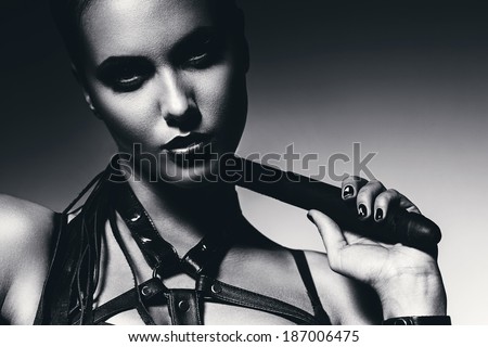 bw portrait of woman with whip around neck