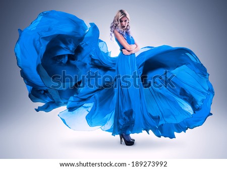 blond woman in long beautiful blue dress