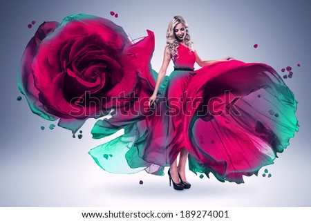 woman in large flying pink and green dress