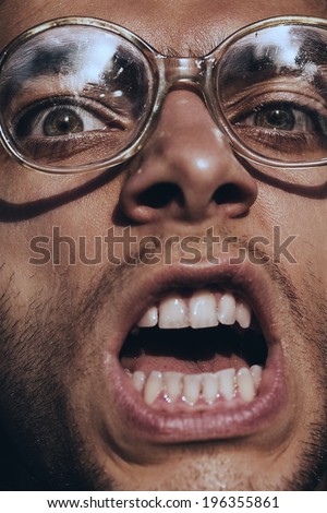 angry screaming man in glasses
