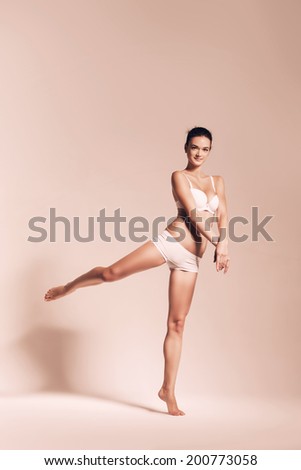 ballet dancer in white underwear in sepia