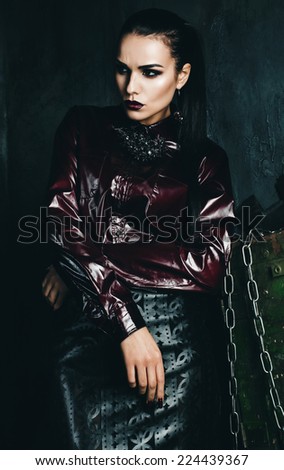 beautiful woman in claret shirt and leather skirt