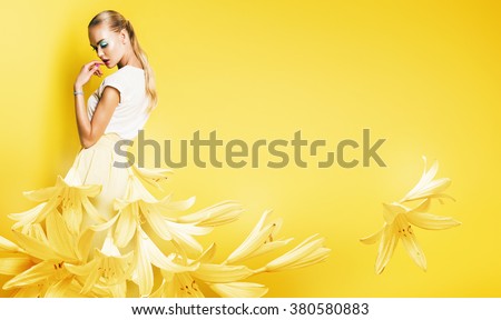 beautiful sexy woman in yellow flower dress on yellow background