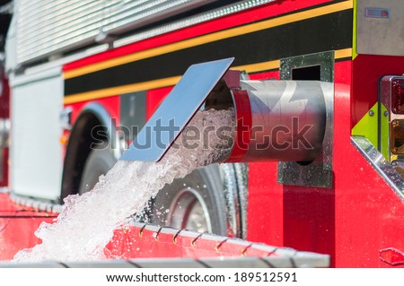 Fire Tanker truck filling a drop tank during a training event