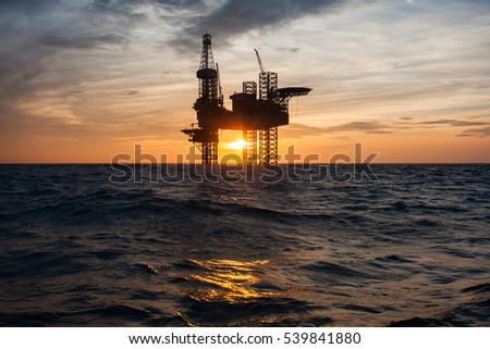 Silhouette of offshore oil drilling rig
