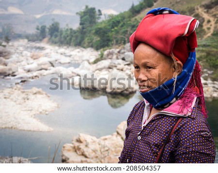 Woman from Red Dao minority group wearing traditional headdress near Ban Ho village in Sapa, Lao Cai, North Vietnam.