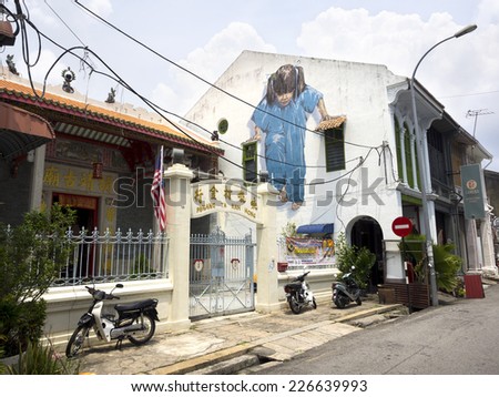Georgetown Penang Malaysia April 25 2014 Little Girl in Blue street art mural by Lithuanian artist Ernest Zacharevic in George Town Penang Malaysia Georgetown Penang Malaysia April 25 2014 Little Girl in Blue street art mural by Lithuanian artist Ernest Zacharevic in George Town Penang Malaysia