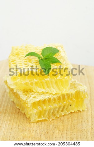honeycombs on a wooden plate