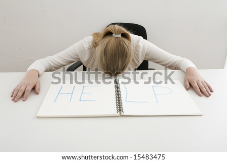 exhausted businesswoman lying on desk need help