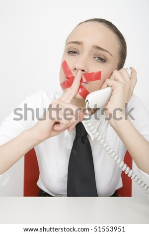 stock photo Business Woman on phone with mouth gagged
