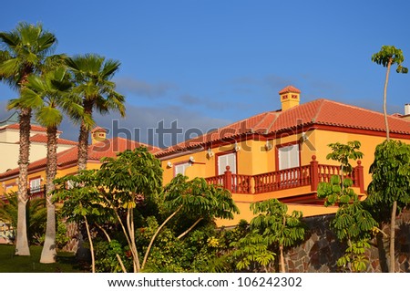Classical spanish villa among palm trees, Costa Adeje, Tenerife, Canary Islands, Spain