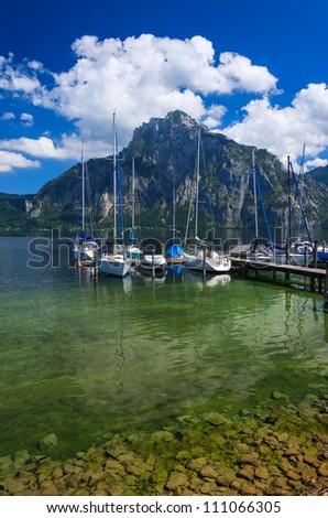 Beautiful lake with boats and yachts in the marina and mountains in the background, Gmunden, Traunsee, Upper Austria
