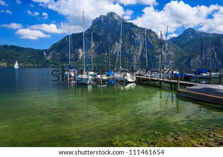 Beautiful lake with boats and yachts in the marina and mountains in the background, Gmunden, Traunsee, Upper Austria