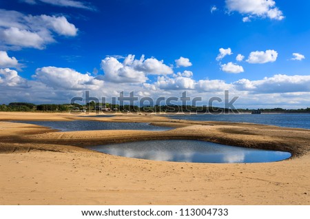 Small lakes and sand with clouds on blue sky, Chancza lake, Poland
