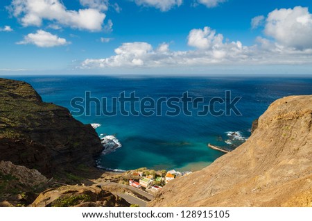 Ocean view coast mountain valley white clouds blue sky, near Alojera village, La Gomera, Canary Islands