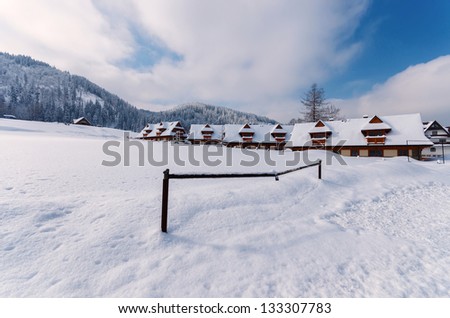 Mountain houses winter snow landscape, Zakopane village, Tatra Mountains, Poland