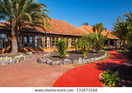 Path luxury hotel building palm tree garden, La Gomera island, Spain