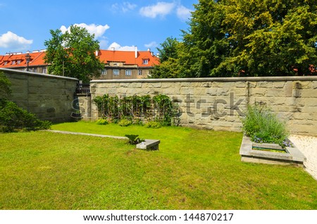 Courtyard park garden green grass lawn, Saint Zygmunt church, Bielany, Warsaw, Poland