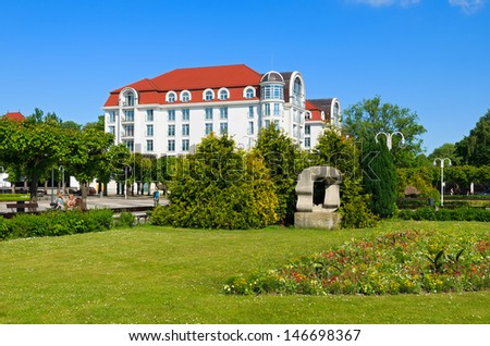 Luxury hotel building public park garden green lawn flower promenade, Sopot, Baltic Sea, Poland