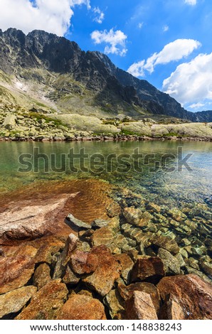 Mountain alpine lake valley stones green clear water summer landscape, 5 lakes valley (Piat Spisskich Ples), High Tatras, Slovakia