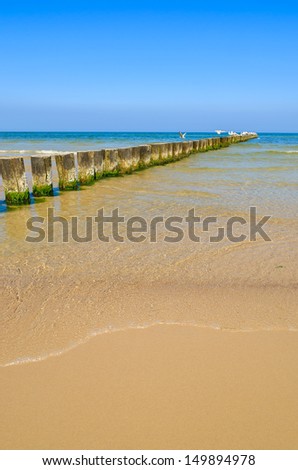 Sand beach wave breakers sea view horizon blue sky, Ustka, Baltic Sea, Poland