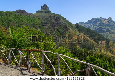 Wooden fence palm tree and mountains view in north of Madeira island, Portugal