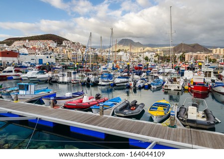 LOS CRISTIANOS, TENERIFE: JAN 25: yacht boats mooring in harbour of popular holiday destination on 25 January 2013. From this place people can take ferry link to La Gomera island.