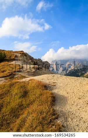 Alpine trail near Falzarego Pass in autumn colors, Dolomiti Mountains, Trentino Alto Adige, italy