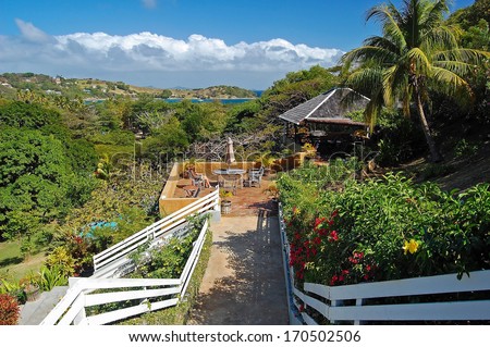 Tropical garden and holiday villas on coast of Bequia island
