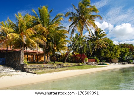 Palm Trees And Holiday Villas On Tropical Beach, Northern Coast Of Mauritius Island