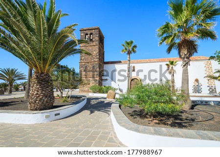 Palm tree square with church in La Oliva village, Fuerteventura, Canary Islands, Spain