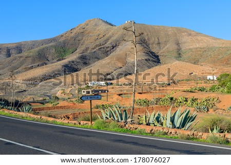 Road and farming fields in rural area of Tefia village, Fuerteventura, Canary Islands, Spain