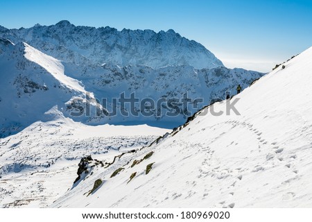 View from alpine trail from 5 lakes valley to Kozi Wierch peak in winter season, High Tatra Mountains, Poland