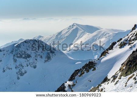 View from alpine trail from 5 lakes valley to Kozi Wierch peak in winter season, High Tatra Mountains, Poland