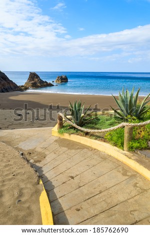 Path and steps to black sand volcanic Prainha beach on east coast of Madeira island, Portugal