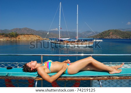 Woman relaxing during boat trip on Aegan sea