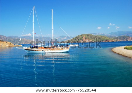 Boat on calm sea water near coast of Turkey