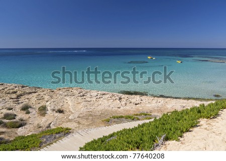 Wooden walkway to beautiful beach in Ayia Napa on Cyprus island