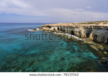 Rock cliffs and turquoise water of Cyprus island