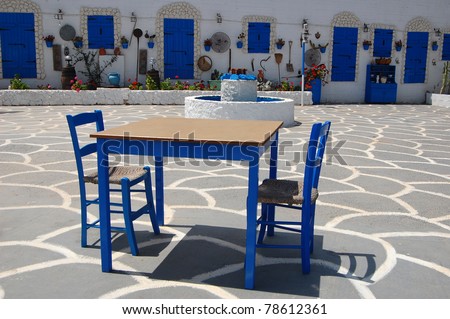 Table with chairs in beautiful greek village of Protaras on Cyprus island